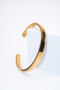Pulsera rígida lisa dorada — baño dorado