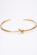 Pulsera rígida nudo dorado