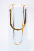 Collar doble capa — cadena plana + cadena con bolitas móviles, baño dorado