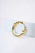 Anillo doble bandas con bolitas móviles — baño dorado