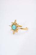 Anillo sol radiante con piedra turquesa — baño dorado