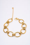 Pulsera eslabón oval con aros anudados — baño dorado